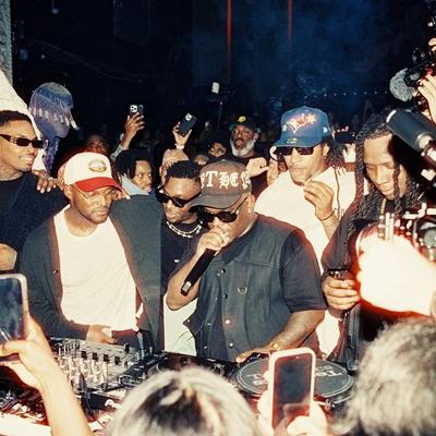Crowded DJ booth mid-set at the Top Dawg Entertainment night